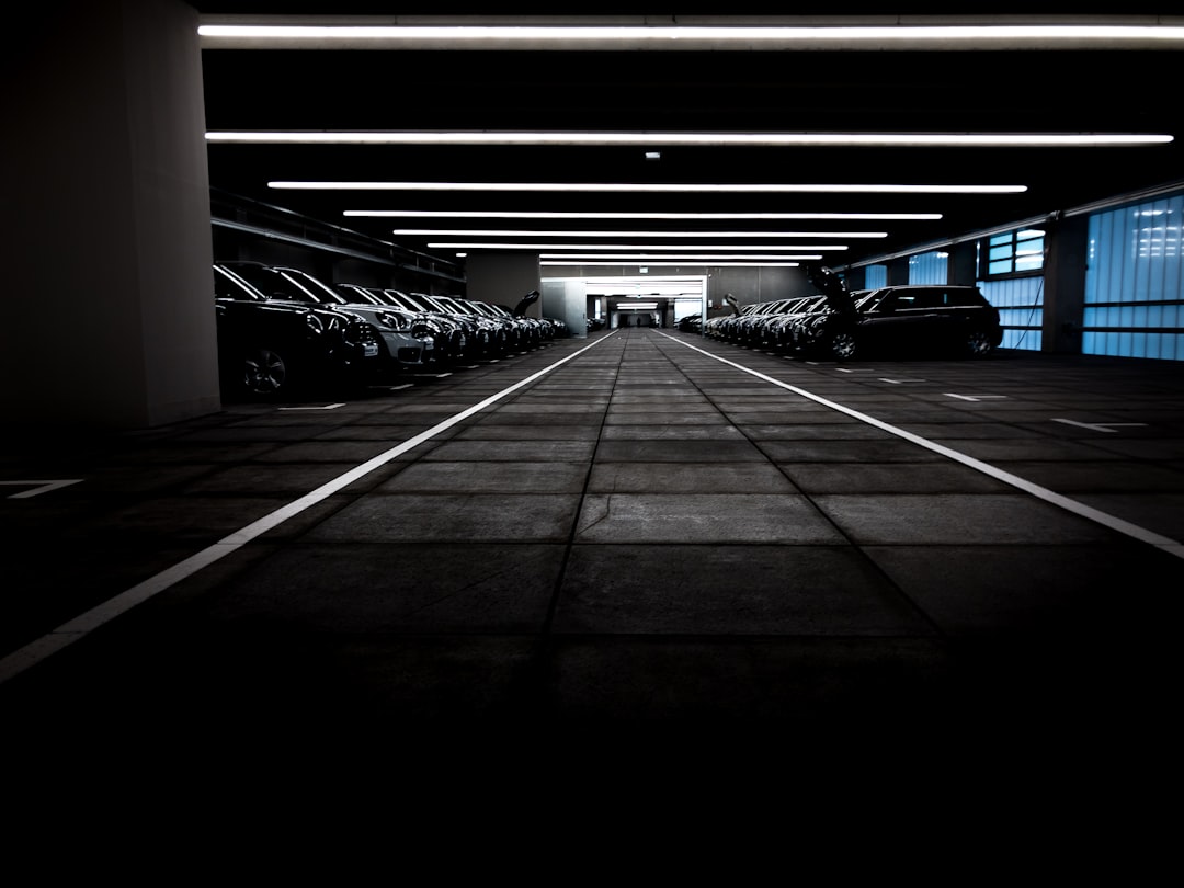 garage with many vehicles of the car brand mini and glowing neon light